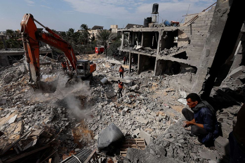PHOTO: Palestinians search for casualties under the rubble at a site of a house destroyed by Israeli strikes in Khan Younis in the southern Gaza Strip Oct. 16, 2023.