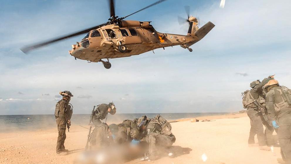 PHOTO: Members of Unit 669 of the Israeli Air Force prepare an Israeli soldier for evacuation at a beach in the Gaza Strip, Jan. 4, 2024