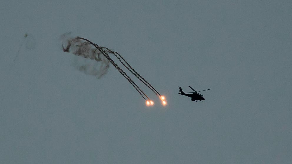 PHOTO: Israeli helicopter fires flares near the border with Gaza, Dec. 29, 2023, in Southern Israel.