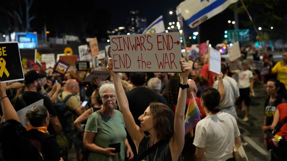 PHOTO: A demonstrator holds a sign about the killing of Hamas leader Yahya Sinwar during a protest calling for a cease-fire deal and the immediate release of hostages held by Hamas, Oct. 17, 2024, in Tel Aviv, Israel. 