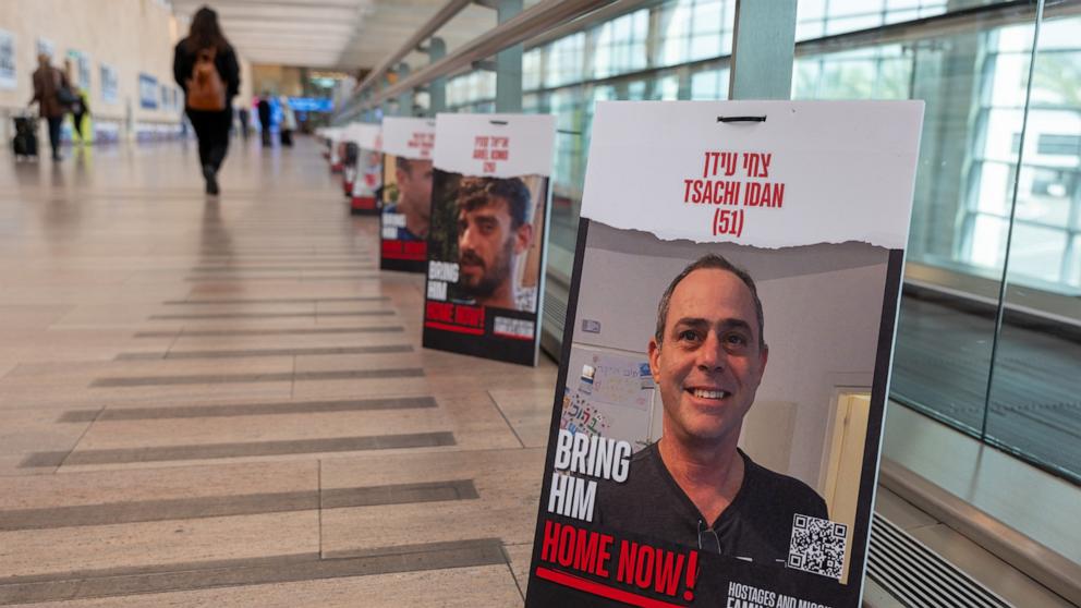 PHOTO: Pictures of hostages taken by Hamas line a walkway at Ben Gurion Airport, December 17, 2023, in Lod, Israel. 