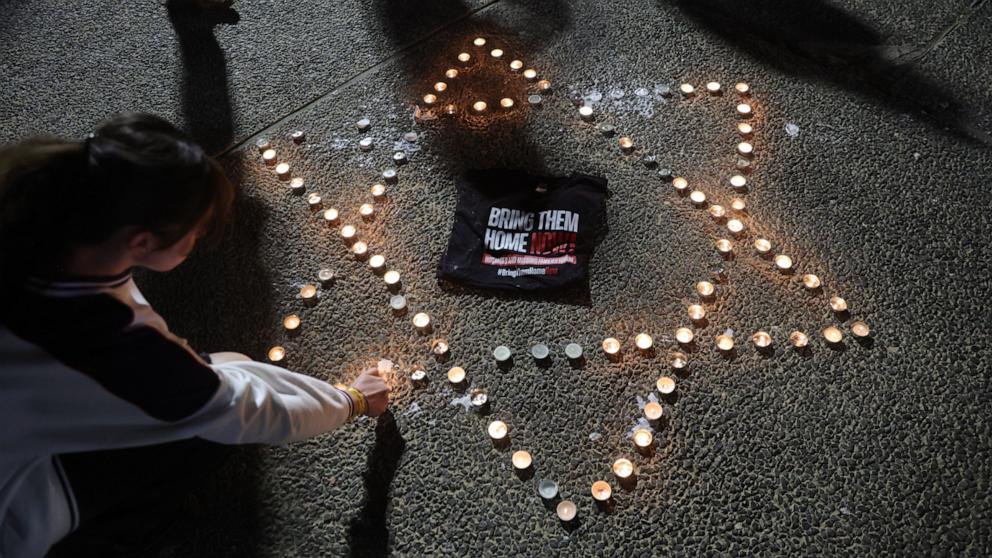 PHOTO: People light candles at the family hostage's plaza at Tel Aviv Museum in Tel Aviv, Israel, Nov. 21, 2023. 