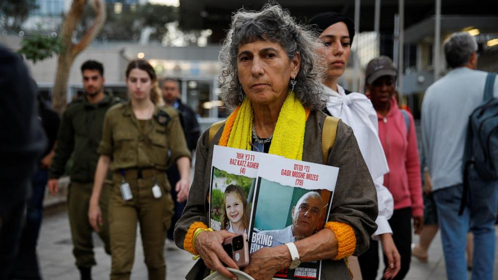 PHOTO: A person holds a sign as the families and supporters of hostages held in Gaza by Hamas gather to raise awareness and demand their immediate release in Tel Aviv, Israel Nov. 22, 2023. 