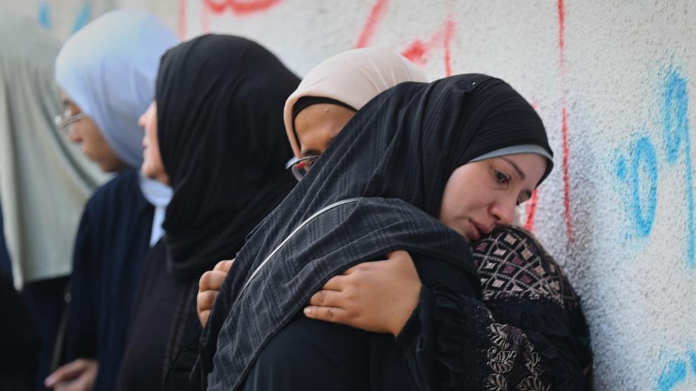PHOTO: Palestinian women mourn their relatives killed in an Israeli army strike, at Shifa Hospital in Gaza City, Oct. 29, 2025. 