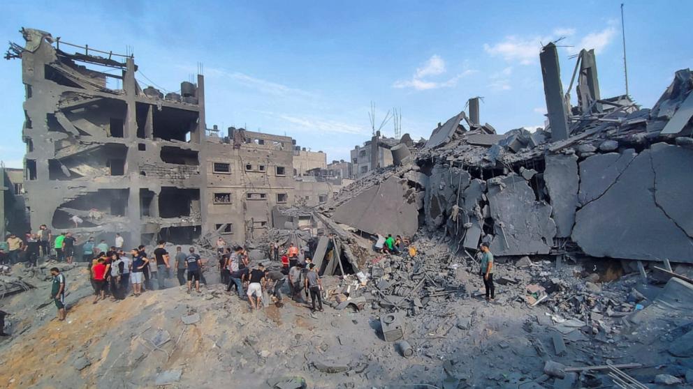 PHOTO: Palestinians search for casualties at the site of air strikes on houses in the Jabalia refugee camp in the northern Gaza Strip, Oct. 31, 2023.