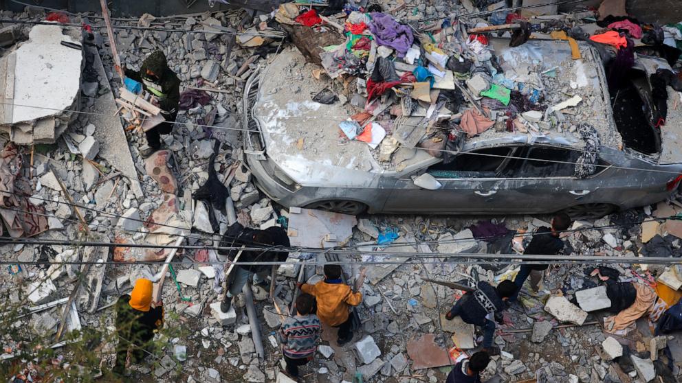 PHOTO: People assess the damage caused by Israeli bombardment in Rafah in the southern Gaza Strip, Feb. 9, 2024, as battles continue between Israel and the Palestinian Hamas movement. 