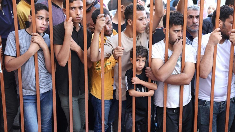 PHOTO: Palestinians wait to collect the bodies of their relatives outside the Nasser hospital, killed in Israeli air strikes, in Khan Yunis, in the southern Gaza Strip, Oct. 26, 2023.