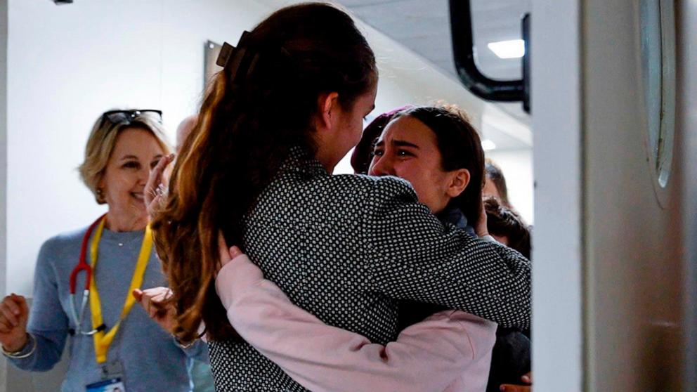 PHOTO: Released Israeli hostage Sahar Kalderon, 16, is embraced by a relative upon her arrival at Sourasky Medical Center in Tel Aviv, Nov. 27, 2023, after being held hostage by militant group Hamas in the Gaza Strip. 