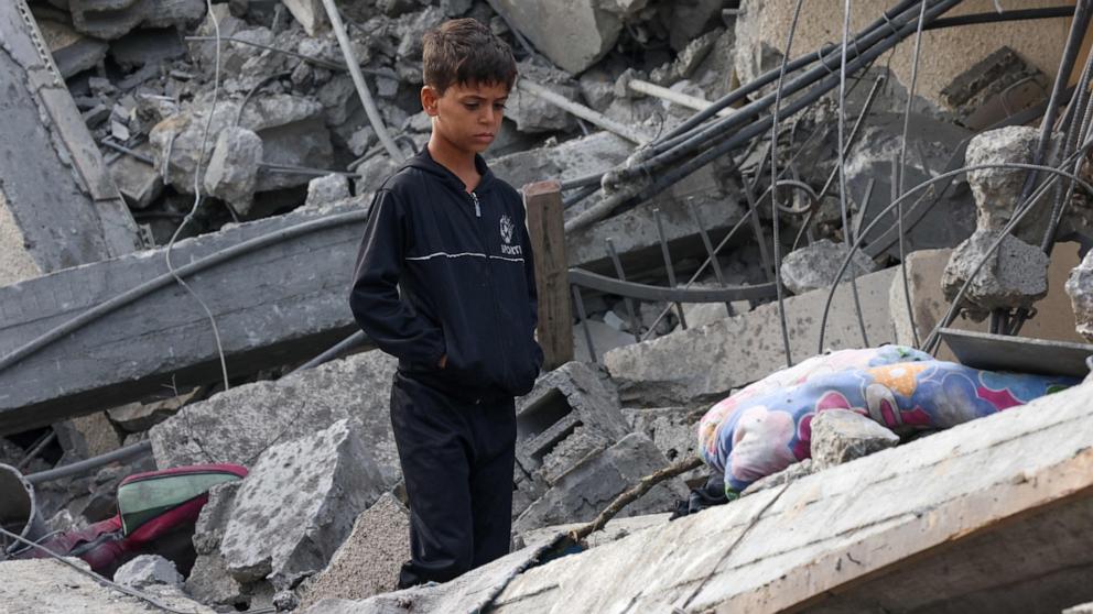 PHOTO: A Palestinian boy stands amidst the rubble of a building following Israeli strikes in Rafah in the southern Gaza Strip, Nov. 22, 2023.