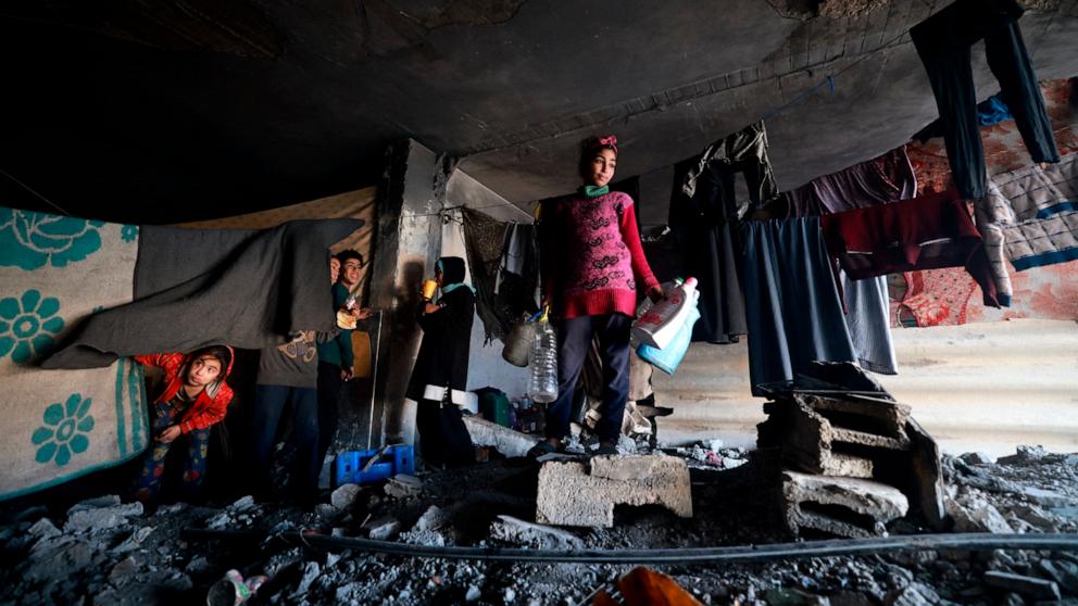PHOTO: Displaced Palestinian children take shelter inside a building damaged during Israeli bombardment in Rafah in the southern Gaza Strip Jan. 17, 2024, amid ongoing battles between Israel and the Palestinian militant group Hamas. 