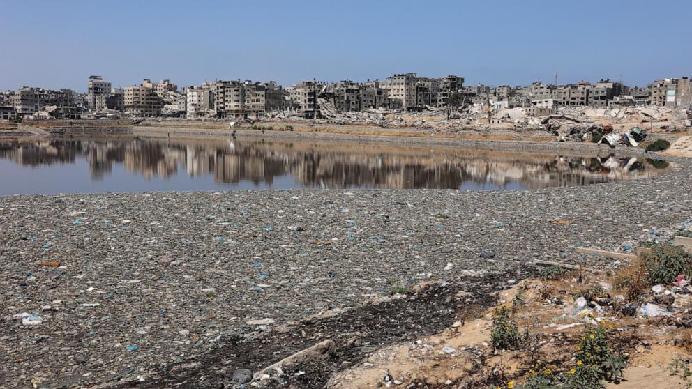 PHOTO: Rubbish accumulates in a non-functioning rainwater reservoir, attracting mosquitos and other insects, causing a health hazard in the area in Gaza City, May 3, 2024.