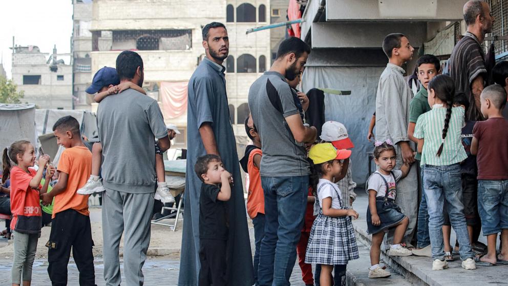 PHOTO: People queue with children for polio vaccinations in Khan Yunis in the southern Gaza Strip, Sept. 5, 2024.