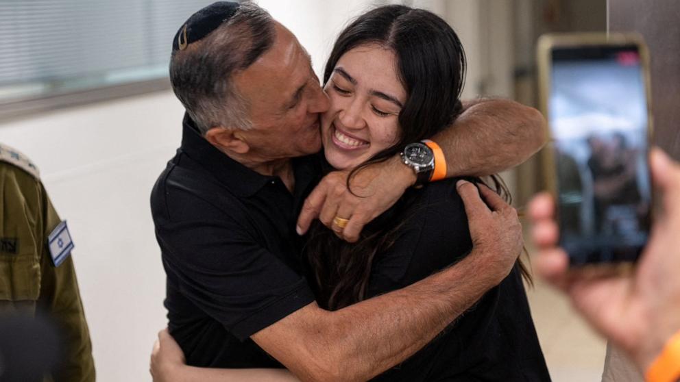 PHOTO: Noa Argamani, a rescued hostage embraces her father, Yakov Argamani, after the military said that Israeli forces have rescued four hostages alive from the central Gaza Strip, in Ramat Gan, Israel, June 8, 2024. 