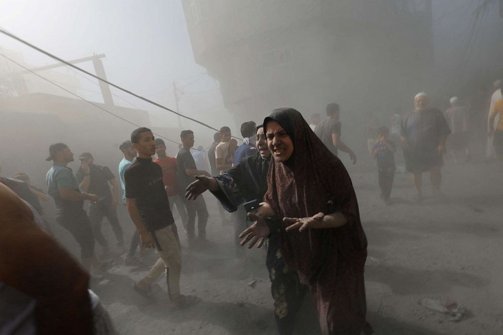 PHOTO: Palestinians react at the site of Israeli air strikes in Khan Younis in the southern Gaza Strip, Oct.26, 2023.