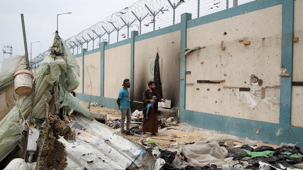 PHOTO: Palestinians inspect a tent camp damaged in an Israeli strike during an Israeli military operation, in Rafah, in the southern Gaza Strip, May 28, 2024. 