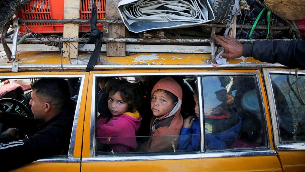 PHOTO: Palestinians, who were displaced to the south at Israel's order during the war, wait to head back to their homes in northern Gaza by vehicle through Salahudeen Road in the central Gaza Strip, Jan. 27, 2025.