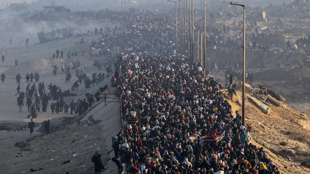 PHOTO: Internally displaced Palestinians walk on Al Rashid road in central Gaza as they return from the south to northern Gaza Strip, Jan. 27, 2025.