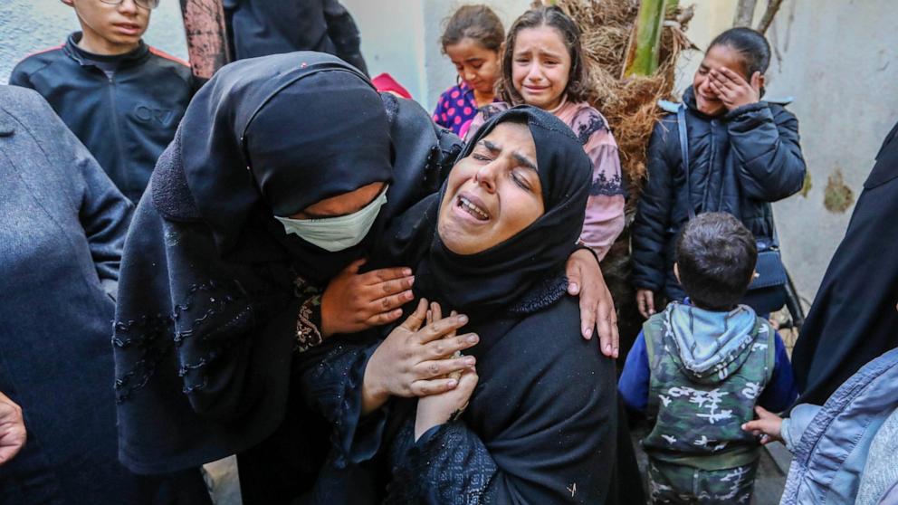 PHOTO: People mourn as they receive the bodies of victims of an Israeli strike on Feb. 22, 2024, in Rafah, Gaza. 