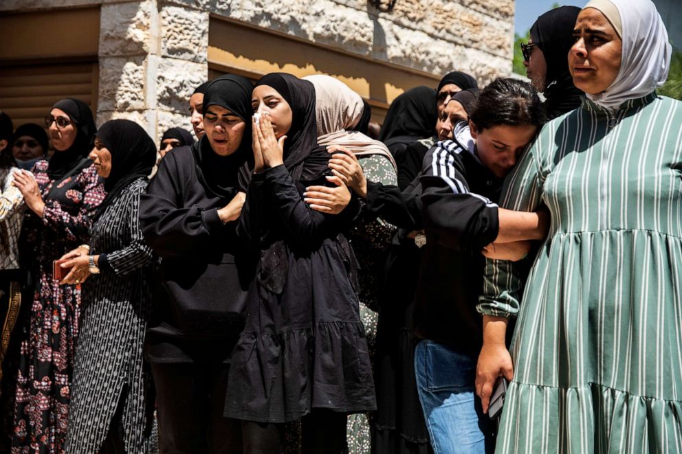 PHOTO: Mourners react during the funeral of Israeli Arab Khalil Awaad and his daughter Nadine, 16, in the village of Dahmash near the Israeli city of Lod, May 12, 2021.