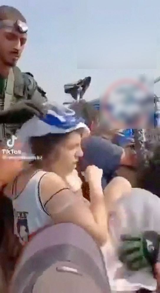 PHOTO: Yoni Asher told ABC News his wife is seen in this screengrab from a social media video published on Oct. 7, 2023 among a group of hostages Hamas militants, at an unknown location.