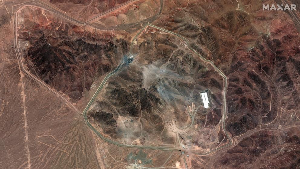 PHOTO: This handout satellite picture provided by Maxar Technologies and taken on June 24, 2025, shows craters along the access roads that lead to the tunnel entrances on Iran's Fordow Fuel Enrichment Plant northeast of the city of Qom.