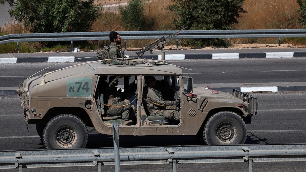 PHOTO: Israeli soldiers aboard a military vehicle at an undisclosed location, near the border with Lebanon in northern Israel, Oct. 11, 2024.