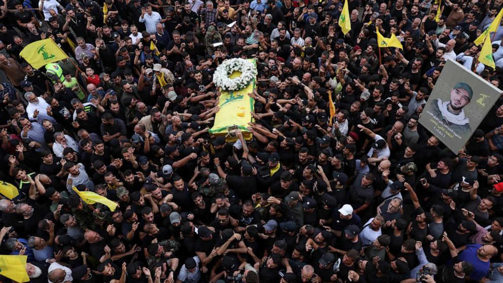 PHOTO: Mourners gather at the funeral of Hezbollah members Fadel Abbas Bazzi and Ahmad Ali Hassan, after hand-held radios and pagers used by armed group Hezbollah detonated across Lebanon, in Ghobeiry, Beirut southern suburbs, Lebanon Sept. 19, 2024.