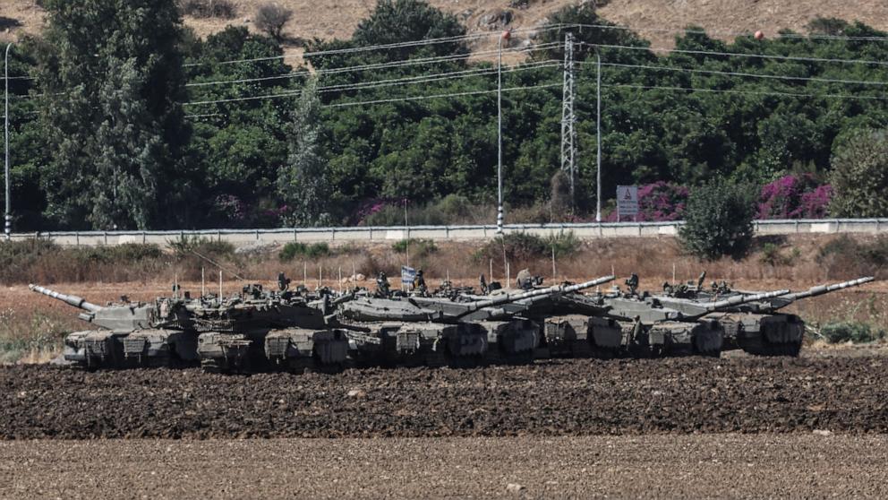 PHOTO: Israeli soldiers and military vehicles gather next to the border with Lebanon, at an undisclosed location along the Israeli side of the border, northern Israel, Oct. 3, 2024.
