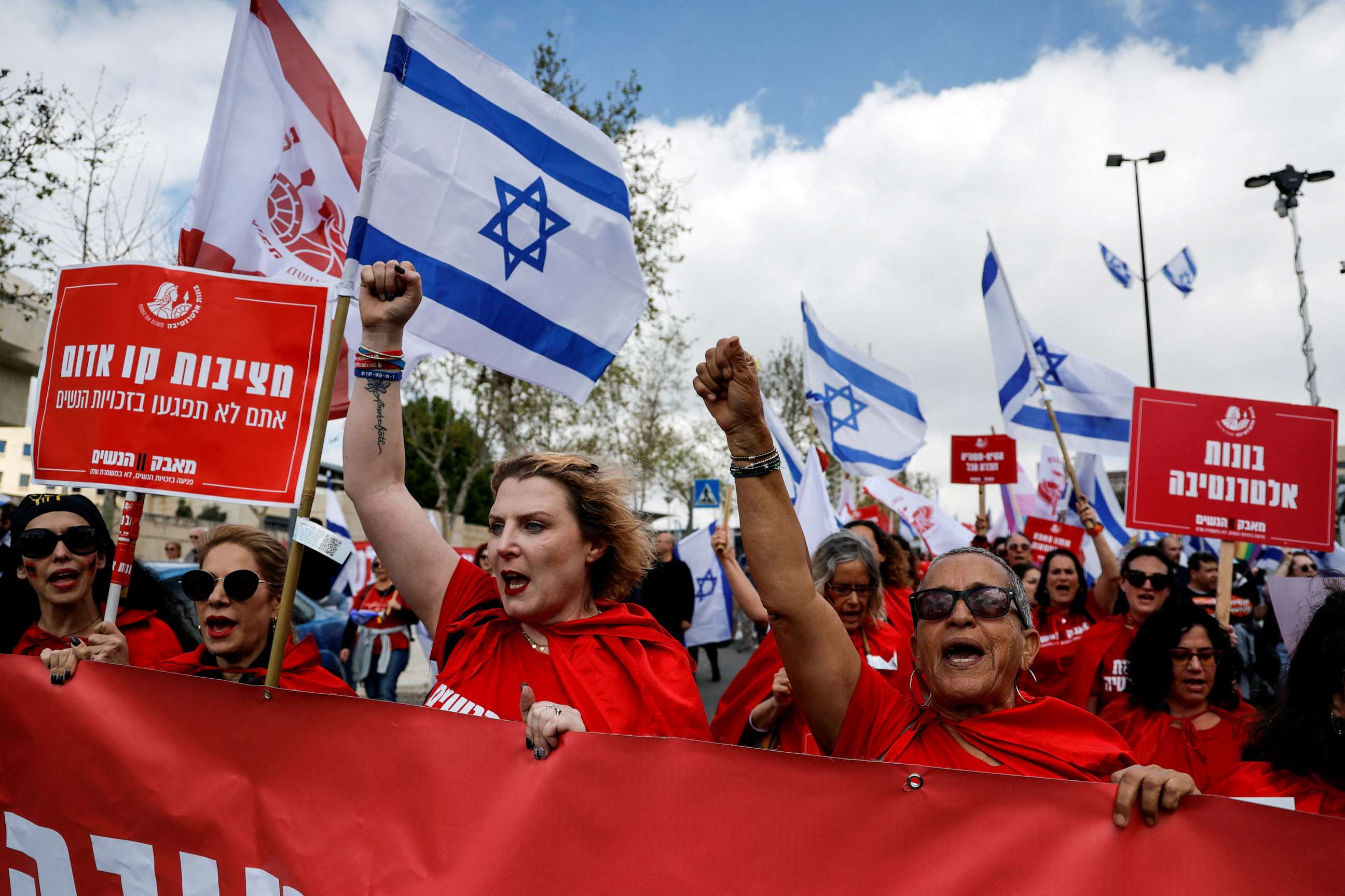 PHOTO: Protestors attend a demonstration after Israeli Prime Minister Benjamin Netanyahu dismissed the defense minister amid his government's plan to overhauld the judicial system, in Jerusalem, March 27, 2023.