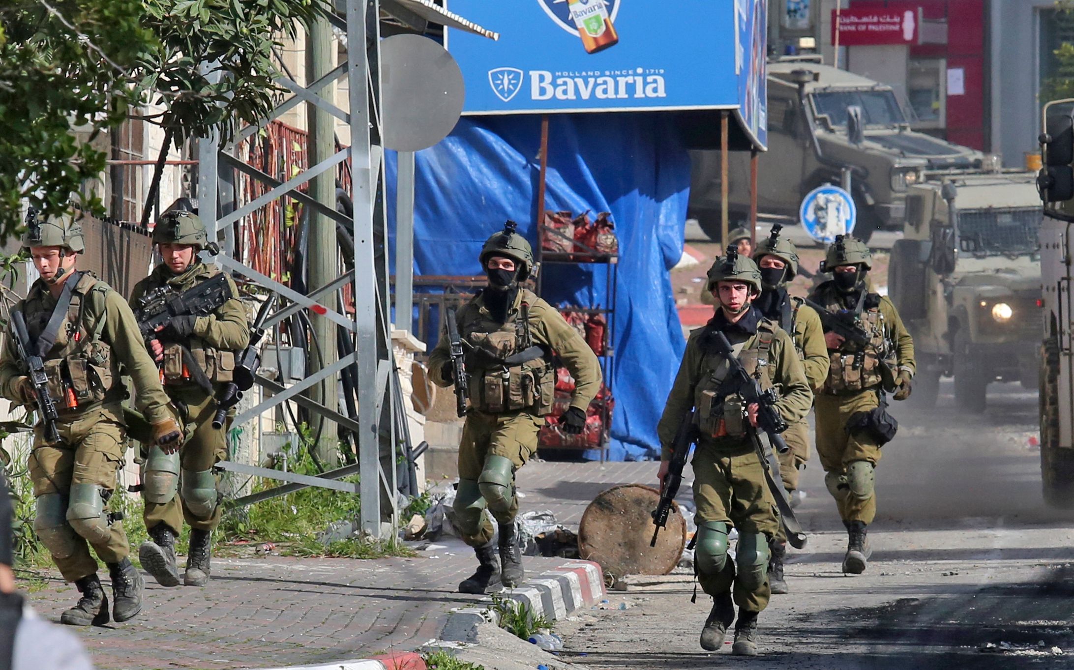 PHOTO: Israeli soldiers patrol on March 30, 2022 in a village south of Jenin in the occupied West Bank, reportedly from where Palestinian assailant Diaa Hamarshah left before killing five people during a gun attack in Israel.