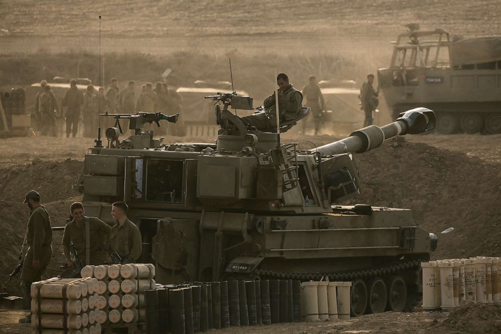 PHOTO: Soldiers sit on an artillery unity near the Israeli border with the Gaza Strip on Oct. 22, 2023 in Netivot, Israel.