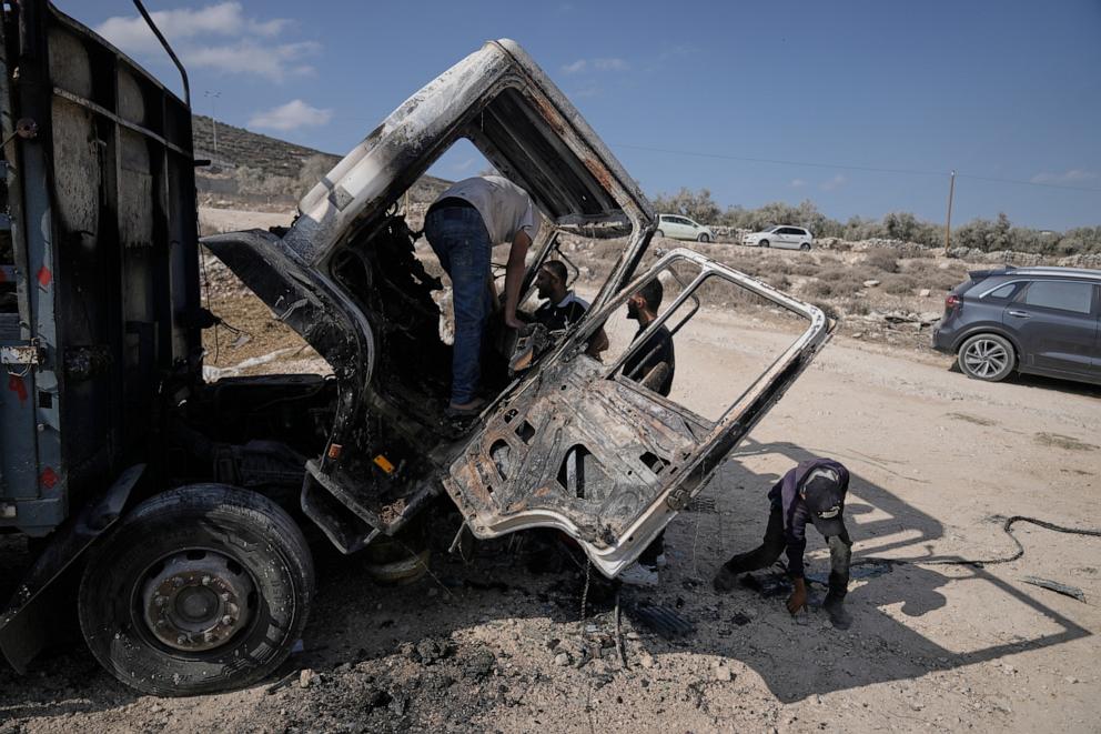 PHOTO: Palestinians survey damage in an industrial zone following an attack by Israeli settlers the previous day in the West Bank village of Beit Lid, near Tulkarm, Wednesday, Nov. 12, 2025.