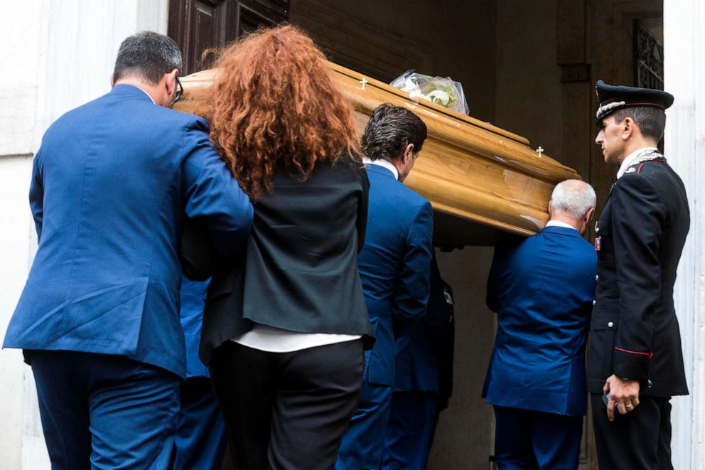 PHOTO: Carabinieri officer Mario Cerciello Rega's wife, Rosa Maria, follows the coffin of her husband as it arrives to be laid in state, in Rome, July 28, 2019. 