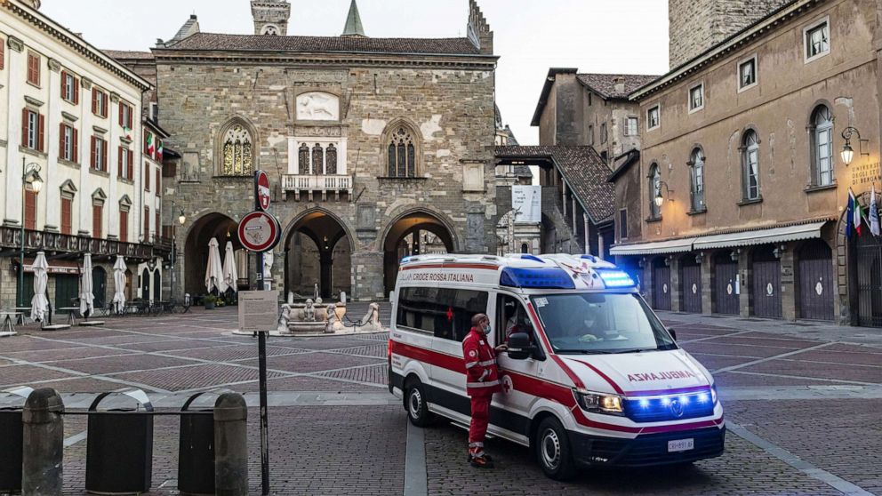 PHOTO: An ambulance of the Italian Red Cross is seen in one of the main squares of the city, on April 8, 2020, in Bergamo, Italy. 