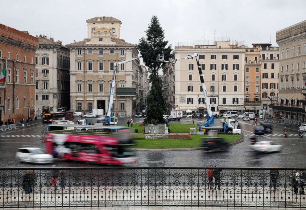 PHOTO: Cranes work around a 65 ft. tall fir tree placed in front of Rome's Unknown Soldier monument, Dec. 3, 2018. 