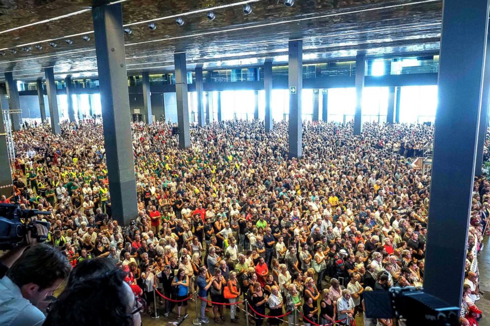 PHOTO: People attend the State funeral for victims of the collapsed Morandi highway bridge on Aug. 18, 2018, in Genoa, Italy.