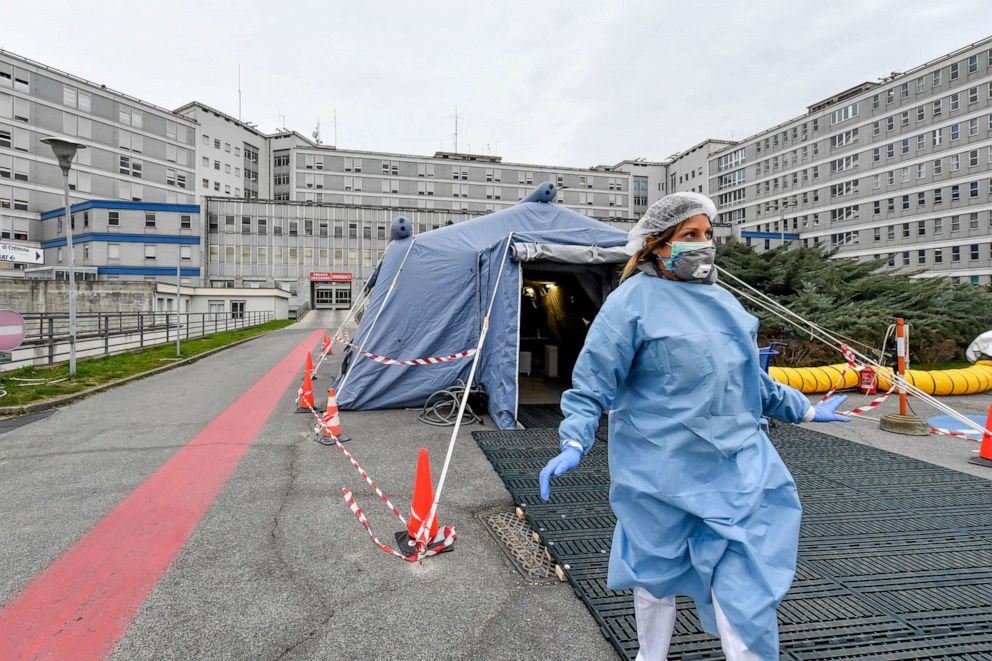 PHOTO: In this file photo taken on Feb. 29, 2020, a paramedic walks out of a tent that was set up in front of the emergency ward of the Cremona hospital in northern Italy.