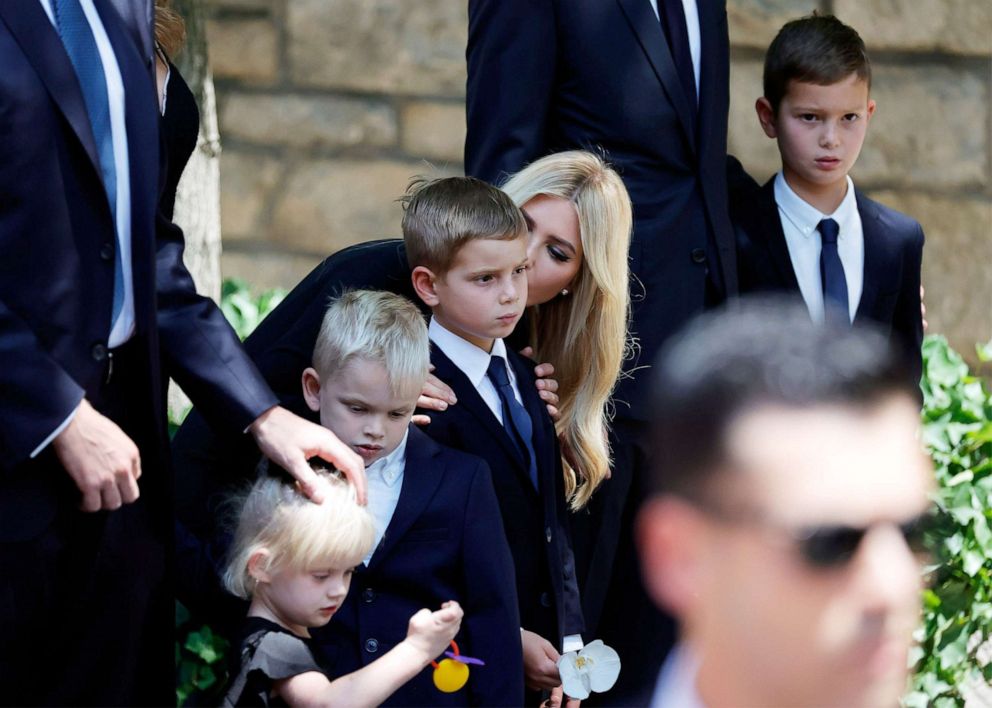 PHOTO: Ivanka Trump, former US President Donald Trump's first wife, kisses one of her sons to inspect the coffin with the remains of Ivana Trump, as it enters St. Vincent Ferrer Roman Catholic Church in New York on July 20, 2022 .