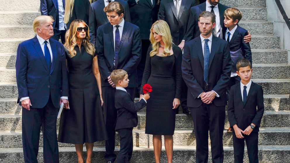 Photo: Former President Donald Trump, far away, and Melania Trump, standing with family members outside St. Vincent Ferrer Roman Catholic Church with Baron Trump, Ivanka Trump and Eric Trump, after Ivana Trump's funeral in New York, July 20, 2022.