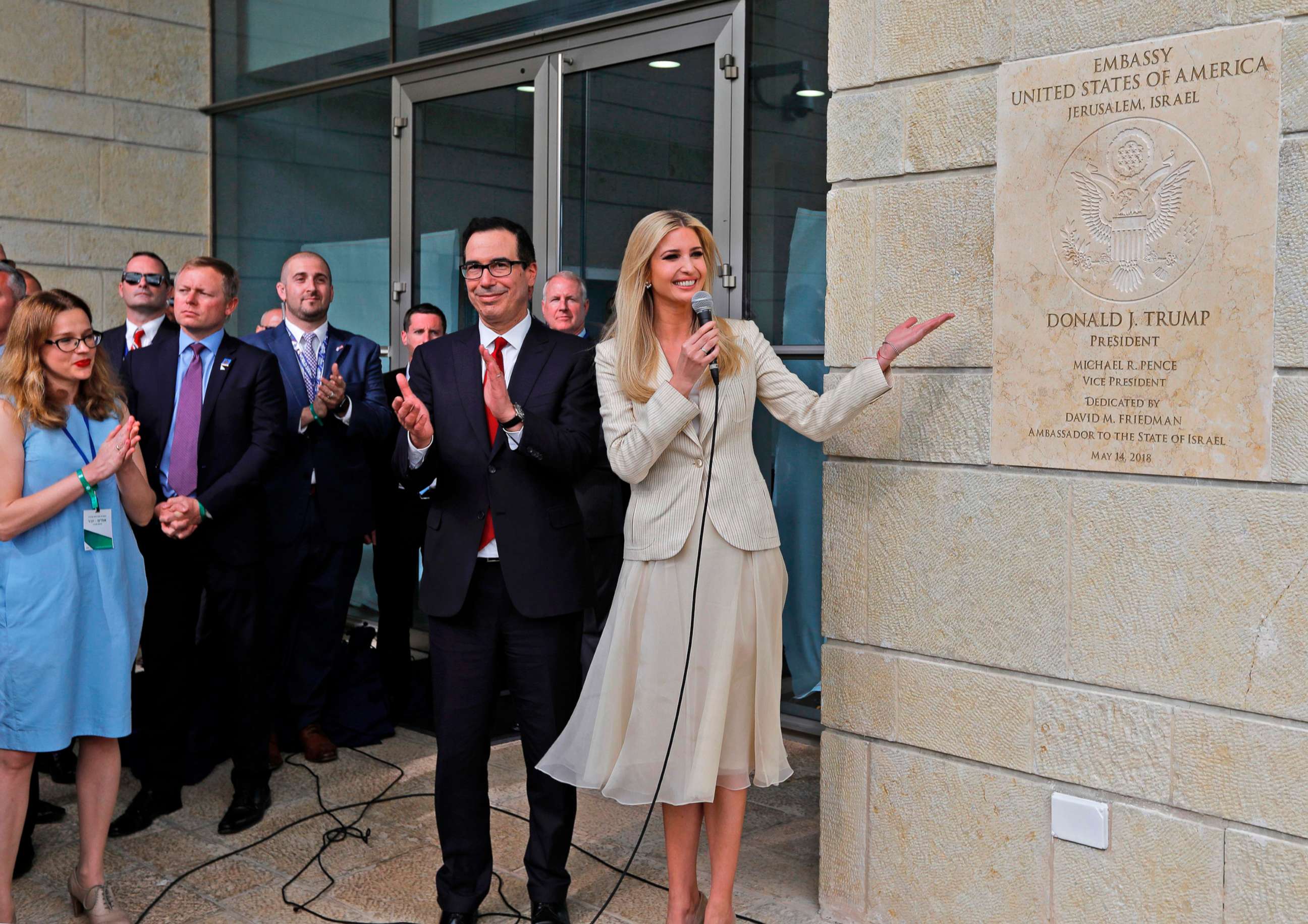 PHOTO: From left, Treasury Secretary Steve Mnuchin claps as White House senior advisor and President Trump's daughter Ivanka Trump unveils an inauguration plaque during the opening of the U.S. embassy in Jerusalem, May 14, 2018.