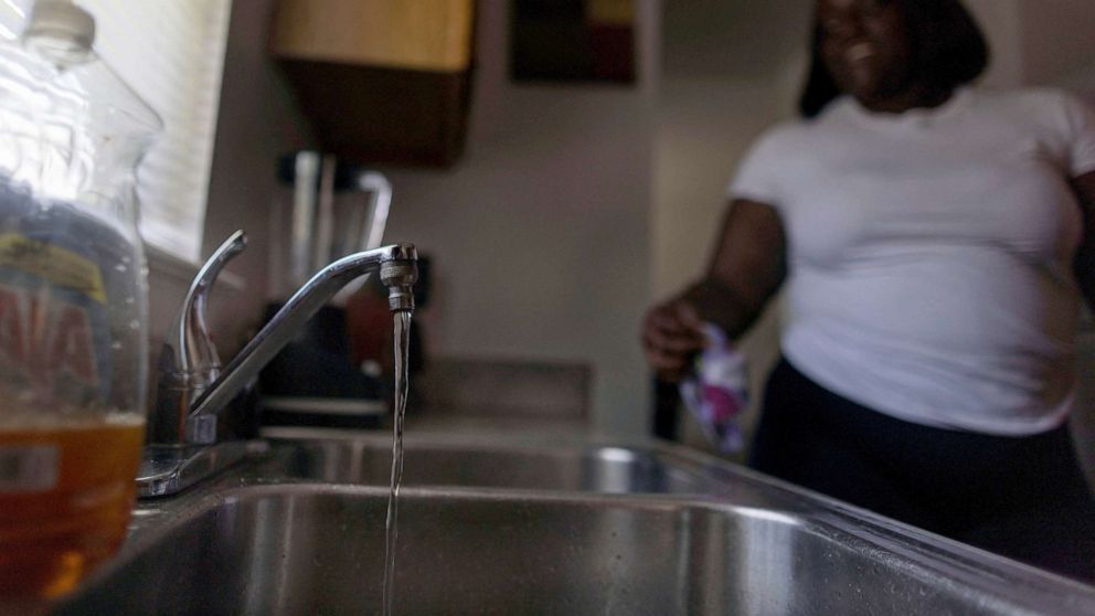 PHOTO: Water is seen running from a faucet in Jackson, Mississippi, Sept. 1, 2022.