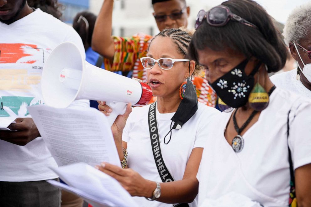 PHOTO: PPeople calling for slavery reparations protest outside the entrance of the British High Commission during the visit of the Duke and Duchess of Cambridge in Kingston, Jamaica, March 22, 2022.