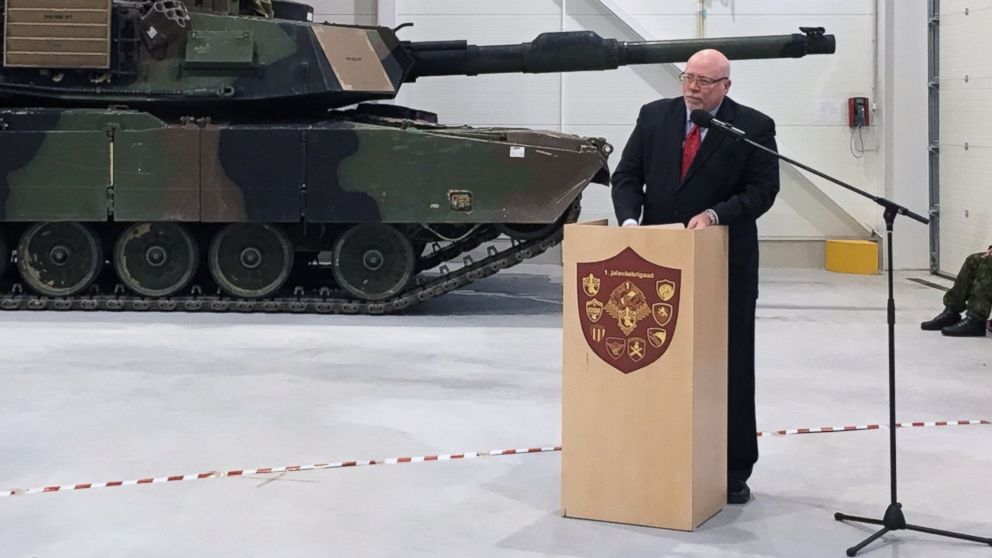 U.S. Ambassador to Estonia James D. Melville Jr. addresses dignitaries in front of an U.S. Army tank, at a hand-over ceremony of the upgraded NATO military base in Tapa, Estonia, Thursday, Dec. 15, 2016.