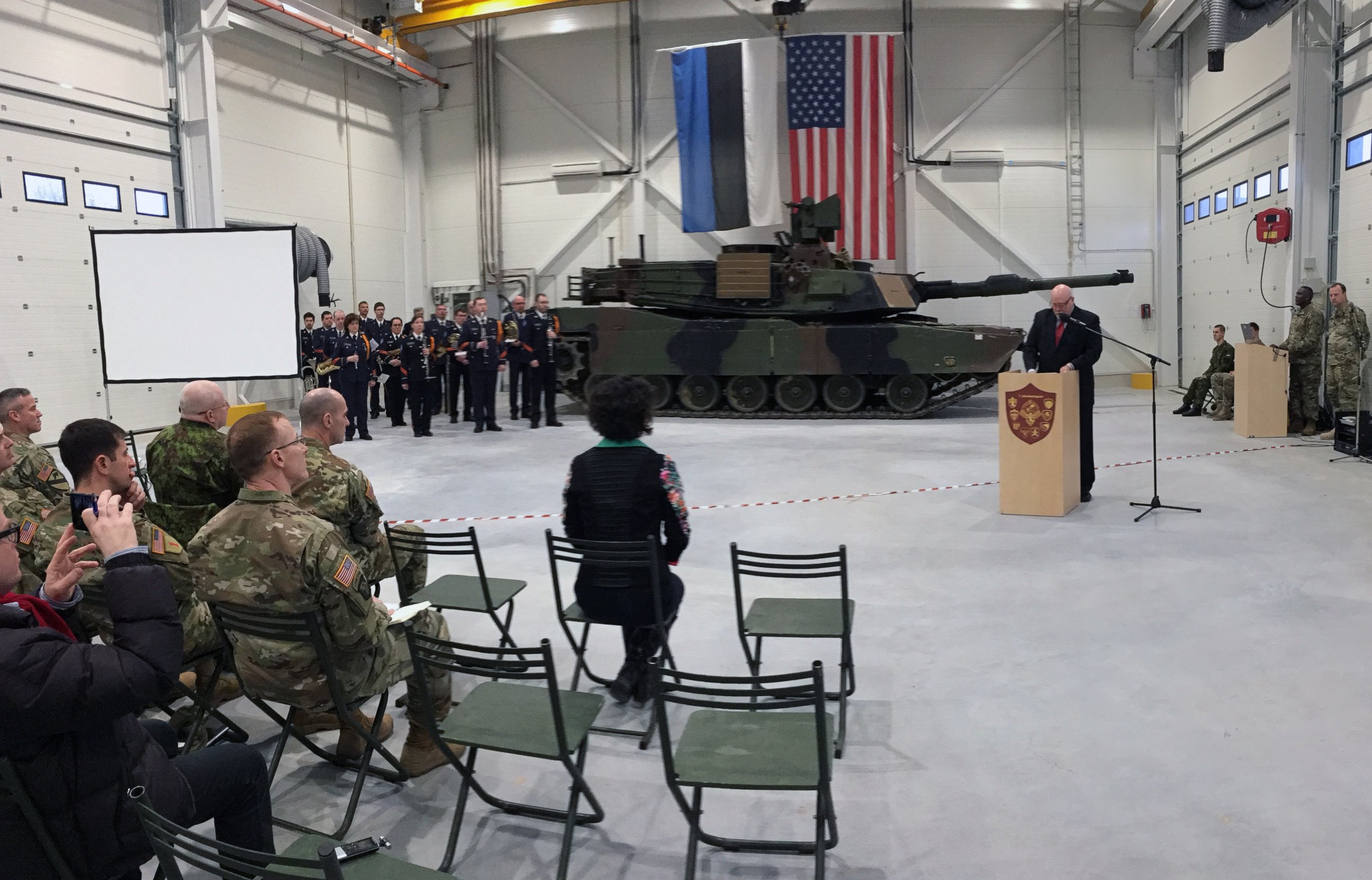 U.S. Ambassador to Estonia James D. Melville Jr. addresses dignitaries in front of an U.S. Army tank, at a hand-over ceremony of the upgraded NATO military base in Tapa, Estonia, Thursday, Dec. 15, 2016.