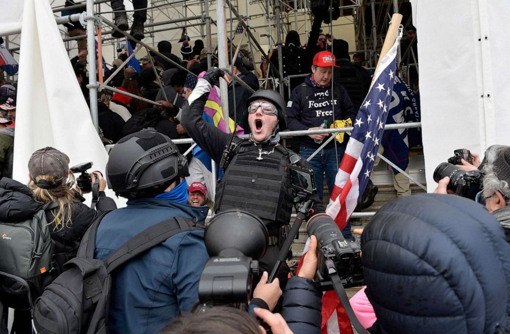 PHOTO: A man calls on people to raid the building as Trump supporters clash with police and security forces as they try to storm the US Capitol in Washington D.C, Jan. 6, 2021.
