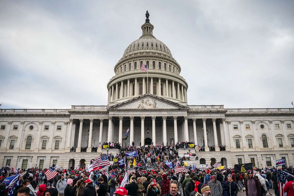 PHOTO: A large group of pro-Trump protesters stand on the East steps of the Capitol Building after storming its grounds, Jan. 6, 2021 in Washington, DC.