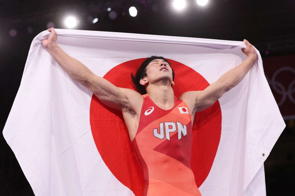 PHOTO: Japan's Takuto Otoguro celebrates his gold medal victory against Azerbaijan's Haji Aliyev in their men's freestyle 65kg wrestling final match during the Tokyo 2020 Olympic Games at the Makuhari Messe in Tokyo on Aug. 7, 2021.