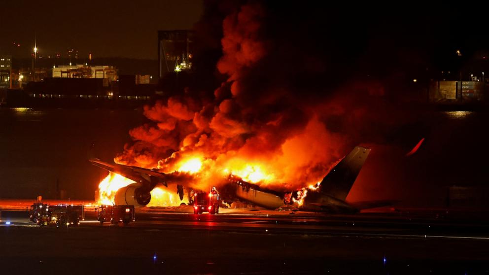 A Japan Airlines plane caught fire at Tokyo Airport with 379 people on board, all of whom escaped