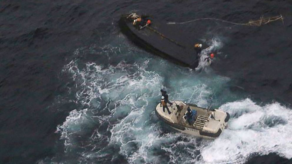 PHOTO: A Japan Coast Guard rescue team approaches a capsized North Korean boat (top) on the Sea of Japan (East Sea), about 225 miles northwest of the Noto Peninsula in Ishikawa Prefecture, Nov. 15, 2017.