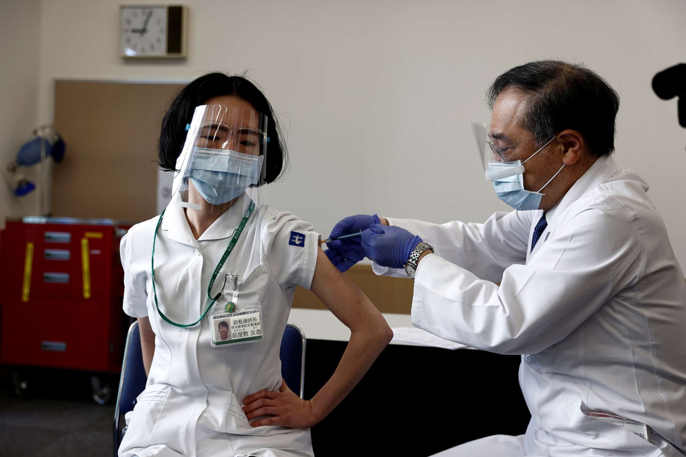 PHOTO: A medical worker receives a dose of the coronavirus vaccine as the country launches its inoculation campaign, in Tokyo, Feb. 17, 2021.